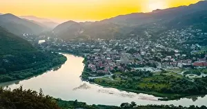 Aerial wide view historical former Georgia capital Mtskheta city with valley and river background