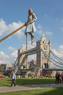 Miss Prints: Aerialist Sally Miller in the character of Emma Bloom takes flight with the backdrop of the Tower Bridge to promote