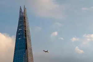 The Shard Prints: An aeroplane flies past the Shard on a sunny evening