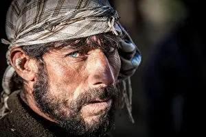 Veil Prints: Afghanistan, Wahkan corridor, a portrait of a man with blue eyes and beard