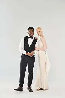 Gown Prints: An African American groom in a tuxedo
