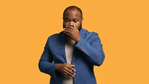 Distressed Prints: African american man covering mouth in disbelief