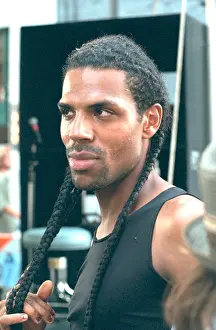 Braids Prints: African American punk rocker man age 30 with braids at Bastille Day