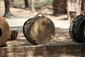 African drums, handmade traditional music instruments on the ground, outdoors. South Africa, Zululand
