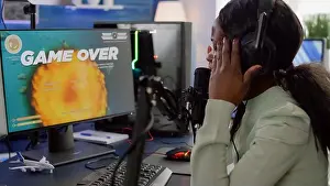 Discussing Prints: African videogame streamer losing online competition wearing professional headset talking on stream chat