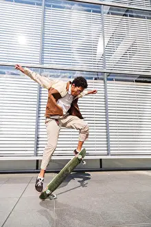 Ramp Prints: Afro man doing ollie and lifts the skate in air
