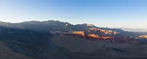 Afternoon sunlight illuminates massive geologic formations in Red Rock Canyon National Conservation Area, located just outside of Las Vegas, NV