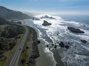 Afternoon sunlight shines on the scenic southern coast of Oregon. This rugged region is found in the Samuel H. Boardman State Scenic Corridor