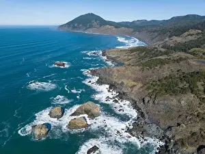 Afternoon sunlight shines on the scenic southern coast of Oregon. This rugged region is found in the Samuel H. Boardman State Scenic Corridor