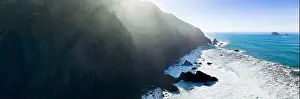 Afternoon sunlight shines on the scenic southern coast of Oregon. This rugged region is found in the Samuel H. Boardman State Scenic Corridor