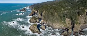 Afternoon sunlight shines on the scenic southern coast of Oregon. This rugged region is found in the Samuel H. Boardman State Scenic Corridor
