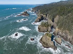 Afternoon sunlight shines on the scenic southern coast of Oregon. This rugged region is found in the Samuel H. Boardman State Scenic Corridor