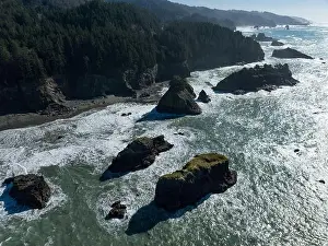Afternoon sunlight shines on the scenic southern coast of Oregon. This rugged region is found in the Samuel H. Boardman State Scenic Corridor