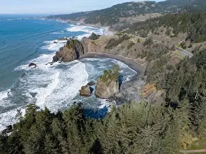 Afternoon sunlight shines on the scenic southern coast of Oregon. This rugged region is found in the Samuel H. Boardman State Scenic Corridor
