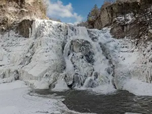 Afternoon winter aerial photo of frozen Ithaca Falls on Fall Creek, City of Ithaca, NY, USA 01-21-2024