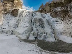 Afternoon winter aerial photo of frozen Ithaca Falls on Fall Creek, City of Ithaca, NY, USA 01-21-2024