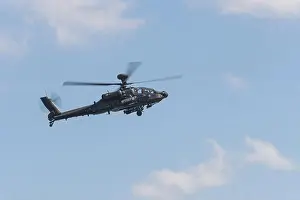 Air Show Prints: AgustaWestland Apache military helicopter displaying at a Duxford air show