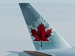 Jetliner Prints: Air Canada maple leaf logo on the tail of one of the company's Boeing 777 (777-300ER) aircraft