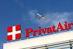 Geneva Prints: Aircraft crossing over the headquarters of the airline company PrivatAir Geneva Switzerland