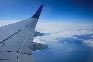 Airplane window view. Sky view from commercial airplane porthole