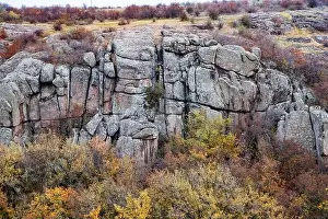 Aktovsky Canyon, Ukraine. Autumn trees and large stone boulders around