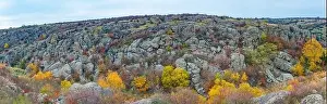 Aktovsky Canyon, Ukraine. Autumn trees and large stone boulders around