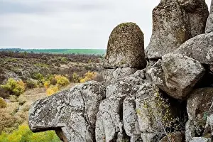 Aktovsky Canyon, Ukraine. Autumn trees and large stone boulders around