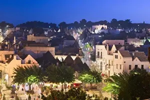 Alberobello, Italy with Trulli houses at dusk