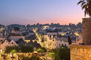 Alberobello, Italy with Trulli houses at dusk