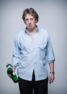 Posh Prints: Alcoholic middle aged professional man following a fight, holding spirits bottle