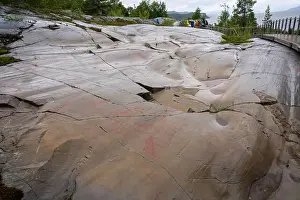 Rock Paintings Prints: Alta, Norway - 07.03.2024: Tourists viewing the Rock Art of Alta in Norway