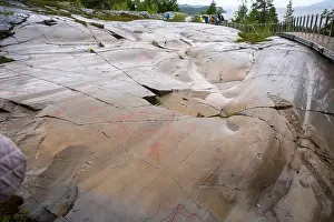 Rock Paintings Prints: Alta, Norway - 07.03.2024: Tourists viewing the Rock Art of Alta in Norway
