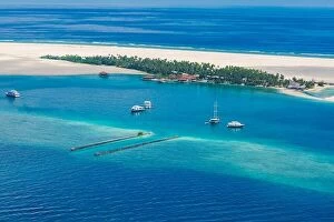 Images Dated 10th December 2015: Amazing aerial view of Maldives island and beach. Drone or airplane view of atoll and island and sea