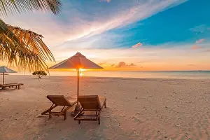 Amazing beach. Chairs on the sandy beach sea. Luxury summer holiday and vacation resort hotel for tourism. Inspirational tropical landscape. Tranquil