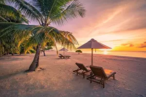 Amazing beach. Chairs on the sandy beach sea. Luxury summer holiday and vacation resort hotel for tourism. Inspirational tropical landscape. Tranquil