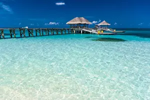 Amazing beach in Maldives with luxury water villas. Exotic background concept