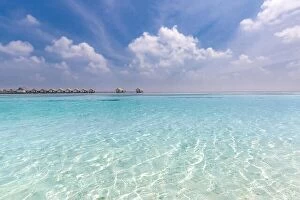 Images Dated 4th January 2017: Amazing beach scene in Maldives island. Tropical sea and luxury over water bungalows