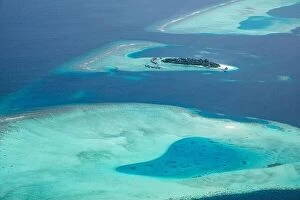 Images Dated 6th August 2019: Amazing bird eyes view in Maldives from plane or drone. Luxury resort hotel water villas bungalows
