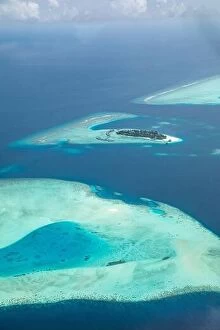 Images Dated 6th August 2019: Amazing bird eyes view in Maldives from plane or drone. Luxury resort hotel water villas bungalows
