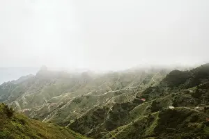 Playa Norte Prints: Amazing drone view of thick fog over majestic rough hills in magnificent nature