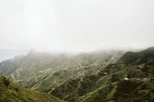 Playa Norte Prints: Amazing drone view of thick fog over majestic rough hills in magnificent nature