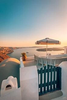 Images Dated 11th October 2019: Amazing evening view over white architecture and romantic sunset light, Santorini, summer romance