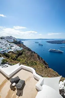 Amazing landscape of Fira, white architecture caldera view Santorini, Greece, cruise ships. Blue sky, wonderful summer mood, sunny vacation, holiday