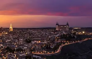 Toledo Prints: From above amazing landscape of illuminated old town in colorful sundown in twilight in Toledo