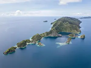 Raja Ampat Prints: Amazing limestone islands rise from the calm seascape around Misool
