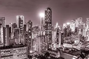 Aerial View Lights Prints: The amazing night and sunset view of cityscape and skyscrapers in Hong-Kong