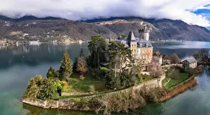 Amazing scenic lakes of European Alps - beautiful Annecy with fairytale castle Duingt on the island