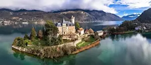Amazing scenic lakes of European Alps - beautiful Annecy with fairytale castle Duingt on the island
