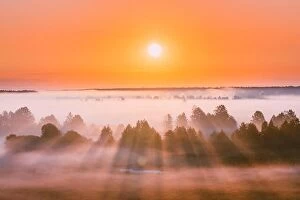 Images Dated 20th July 2017: Amazing Sunrise Over Misty Landscape. Scenic View Of Foggy Morning Sky With Rising Sun Above Misty