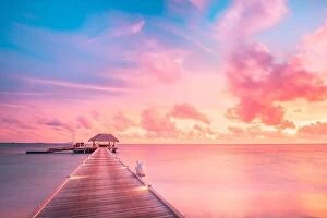 Images Dated 28th May 2019: Amazing sunset sky and reflection on calm sea, Maldives beach landscape of luxury over water